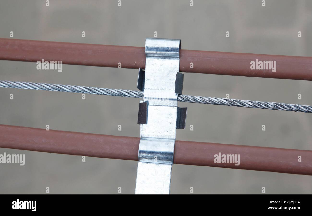 A closeup of a roof and gutter deicing heating cable to prevent ice