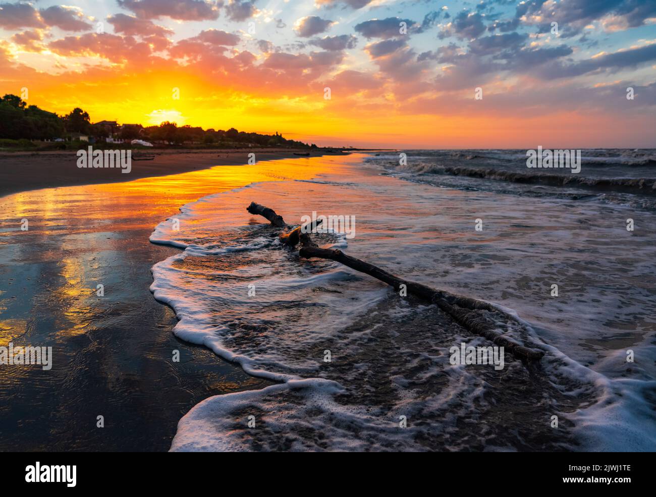 Beautiful sunset on the sea coast Stock Photo - Alamy