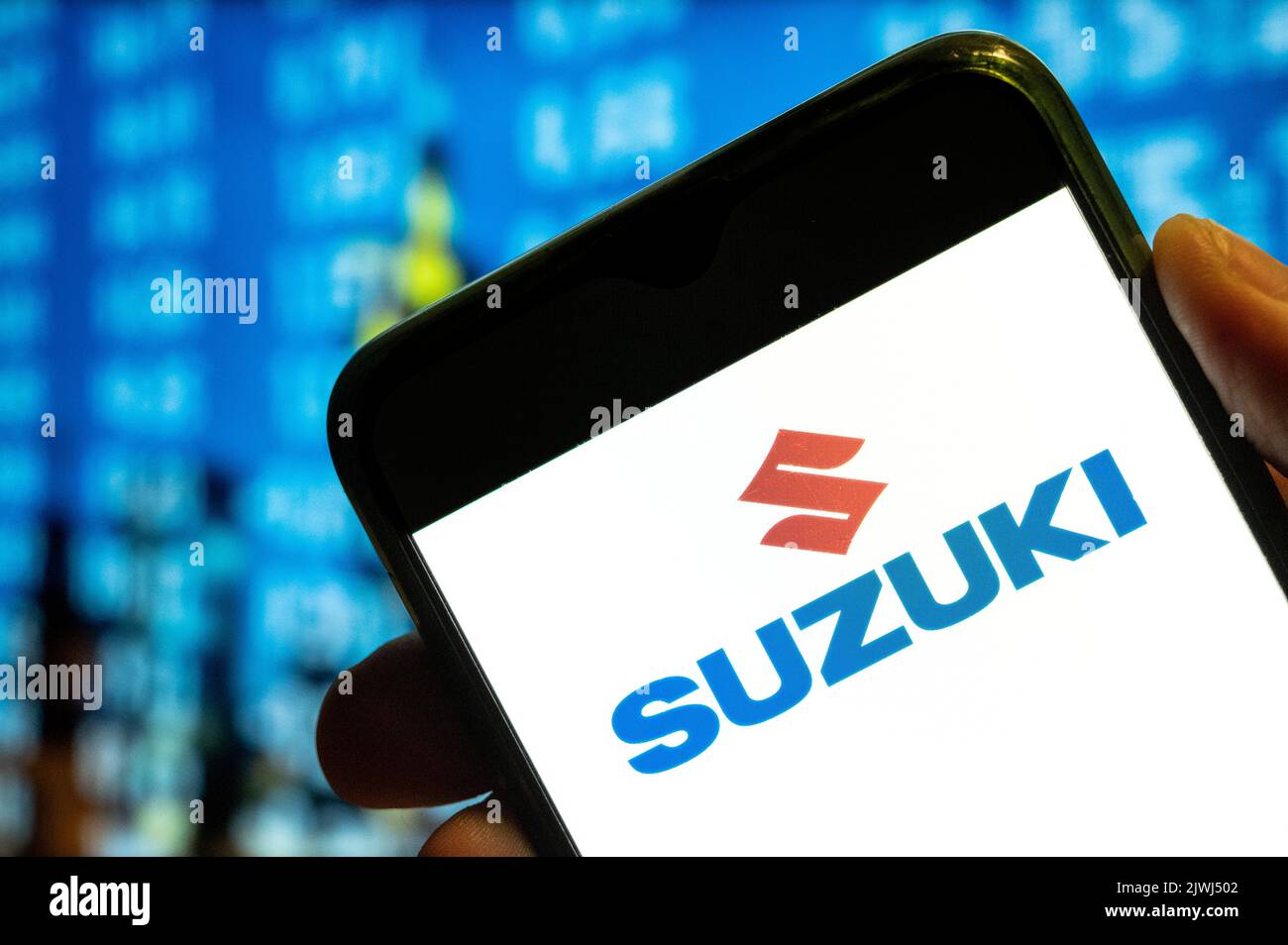 In this photo illustration, the Japanese multinational automobile manufacturer Suzuki logo is displayed on a smartphone screen. Stock Photo