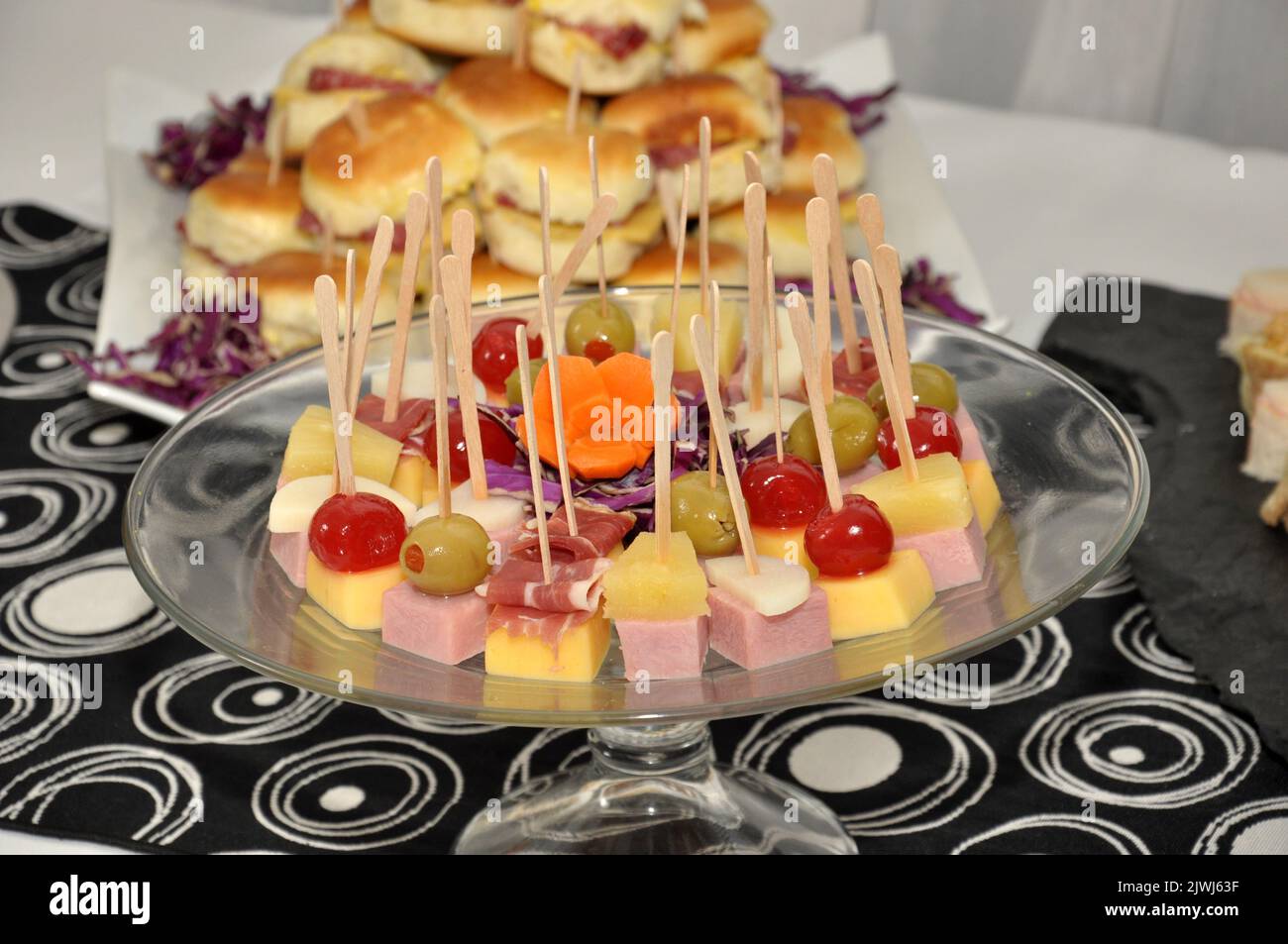 A selective focus shot of a platter of fruit skewers on a dessert buffet table Stock Photo