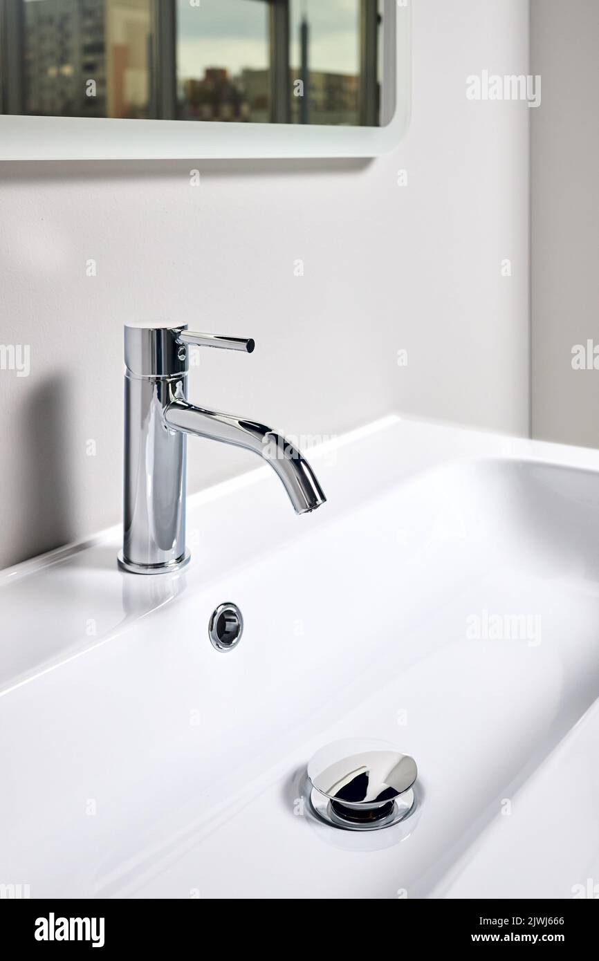 Bathroom interior modern design sink under mirror with window