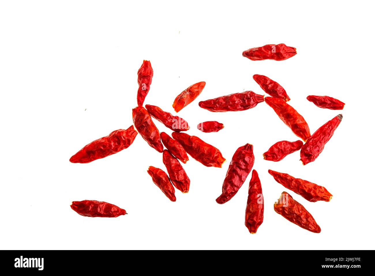 Sun dried homemade whole chilli peppers used in many cuisines as a spice to add heat to dishes Stock Photo
