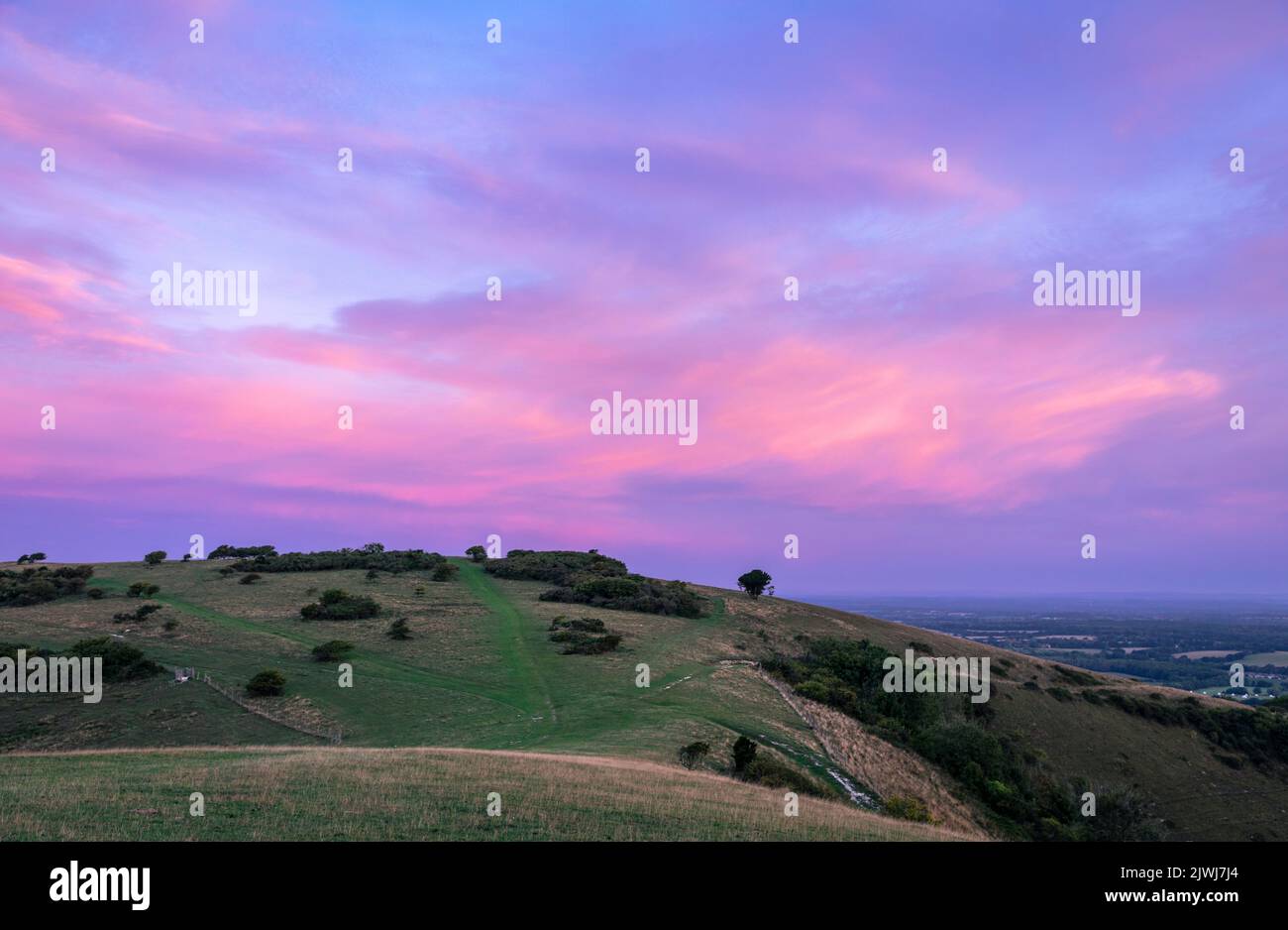 Blue hour lilac sky over Butts Brow on the South Downs near Polegate East Sussex south east England Stock Photo