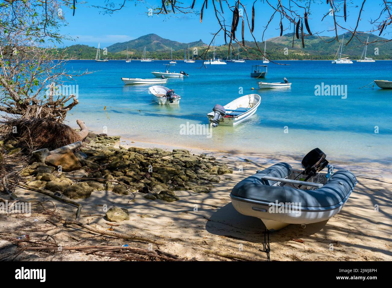 Small boats used by locals for inter-island transport anchored of beach at Nanuya Island, Yasawa Group, Fiji Stock Photo
