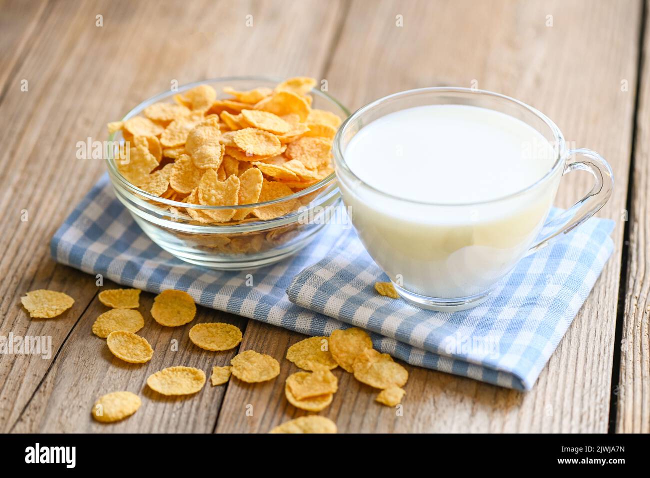 cornflakes bowl breakfast food and snack for healthy food concept, morning breakfast fresh whole grain cereal, cornflakes with milk on table food wood Stock Photo