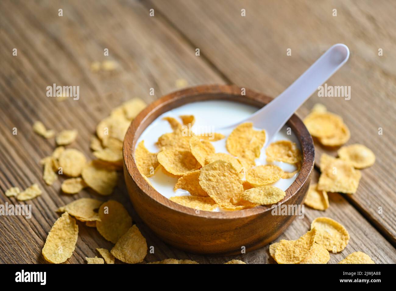 cornflakes bowl breakfast food and snack for healthy food concept, morning breakfast fresh whole grain cereal, cornflakes with milk on table food back Stock Photo
