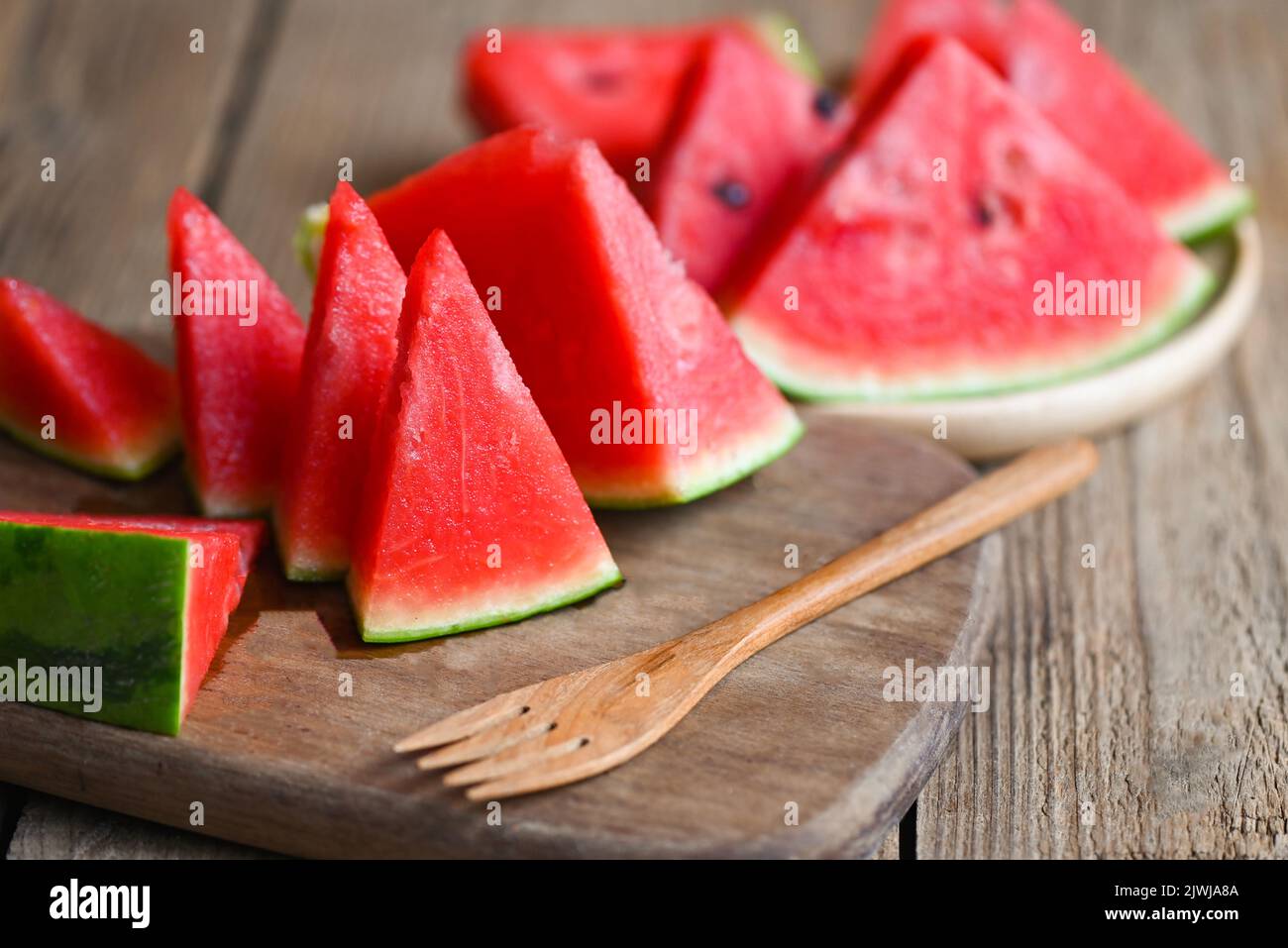 Watermelon slice on wooden background, Closeup sweet watermelon slices pieces fresh watermelon tropical summer fruit Stock Photo