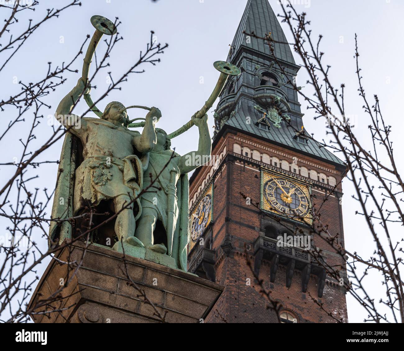 The Lur Blowers monument located near the Copenhagen City Hall. Bronze sculpture of two lur players on top of a high column. Copenhagen, Denmark Stock Photo