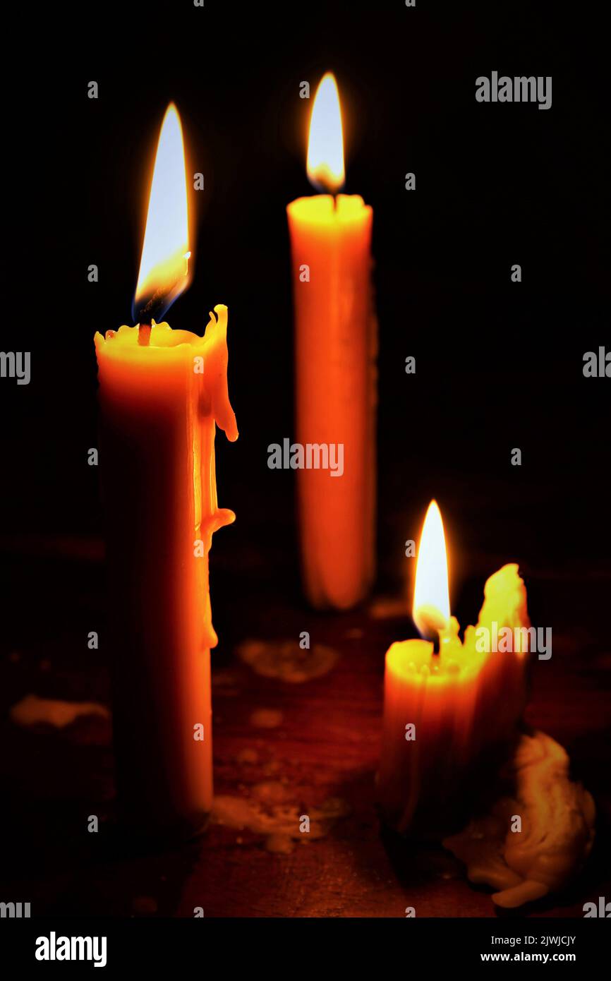 Candles burning in the dark. photo vertical Stock Photo Alamy