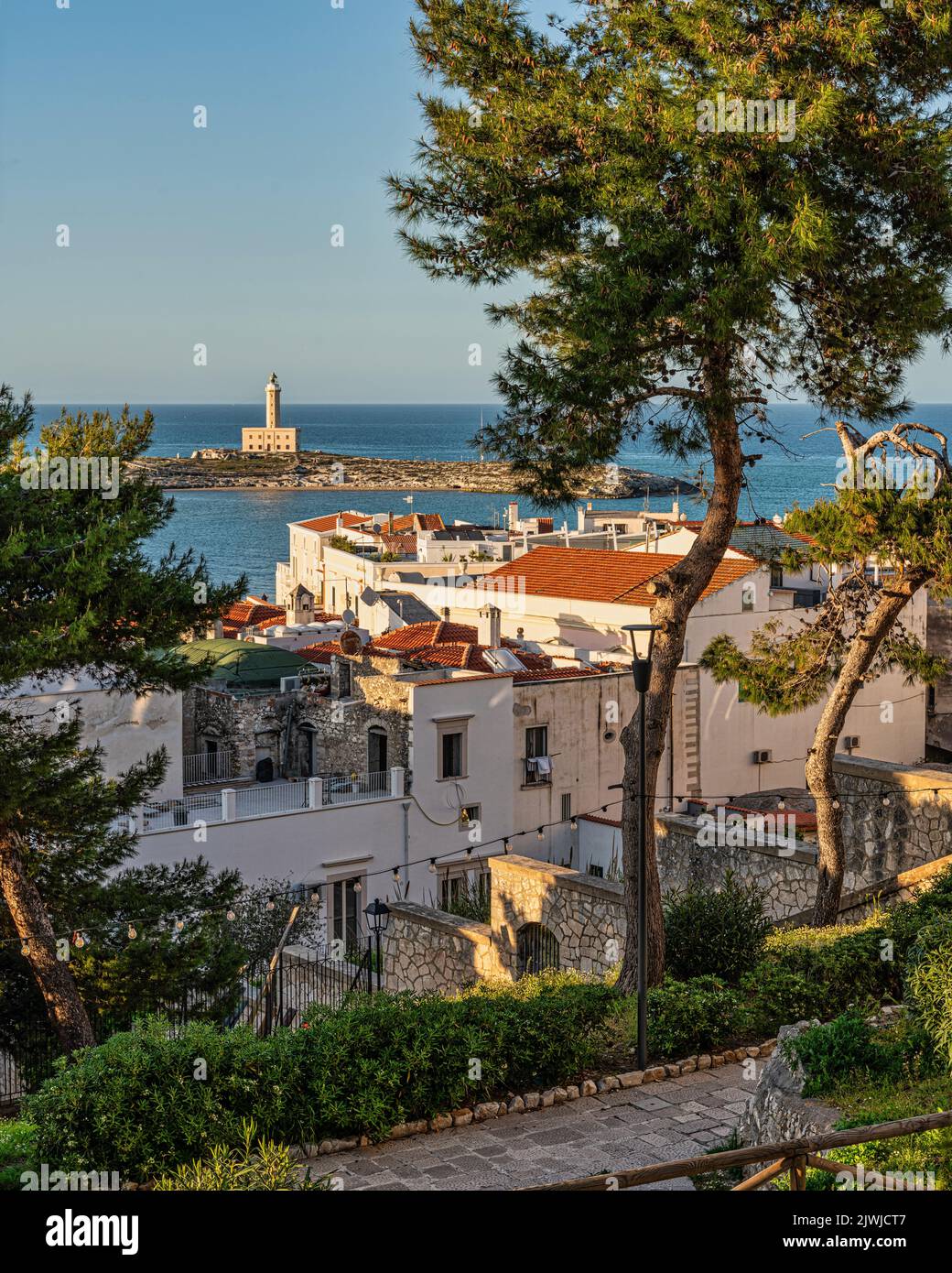 The Vieste lighthouse from the entrance door to the historic center of Vieste. Vieste, Foggia province, Puglia, Italy, Europe Stock Photo