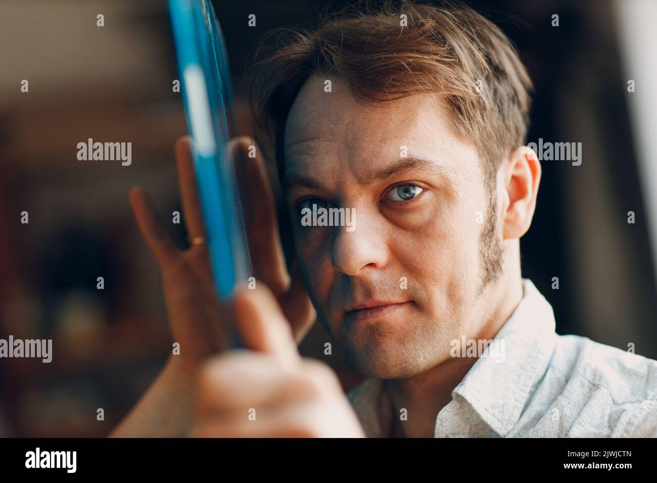 Craftsman artisan stained glass master male checking surface pattern