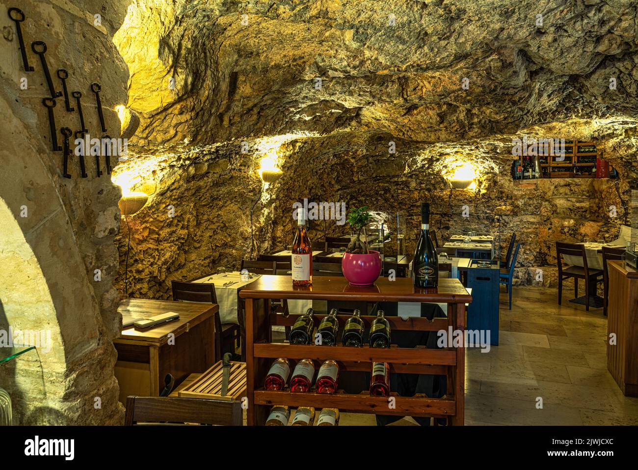 Characteristic restaurant and winery excavated in a cave in the city of Vieste. Vieste, Foggia province, Puglia, Italy, Europe Stock Photo
