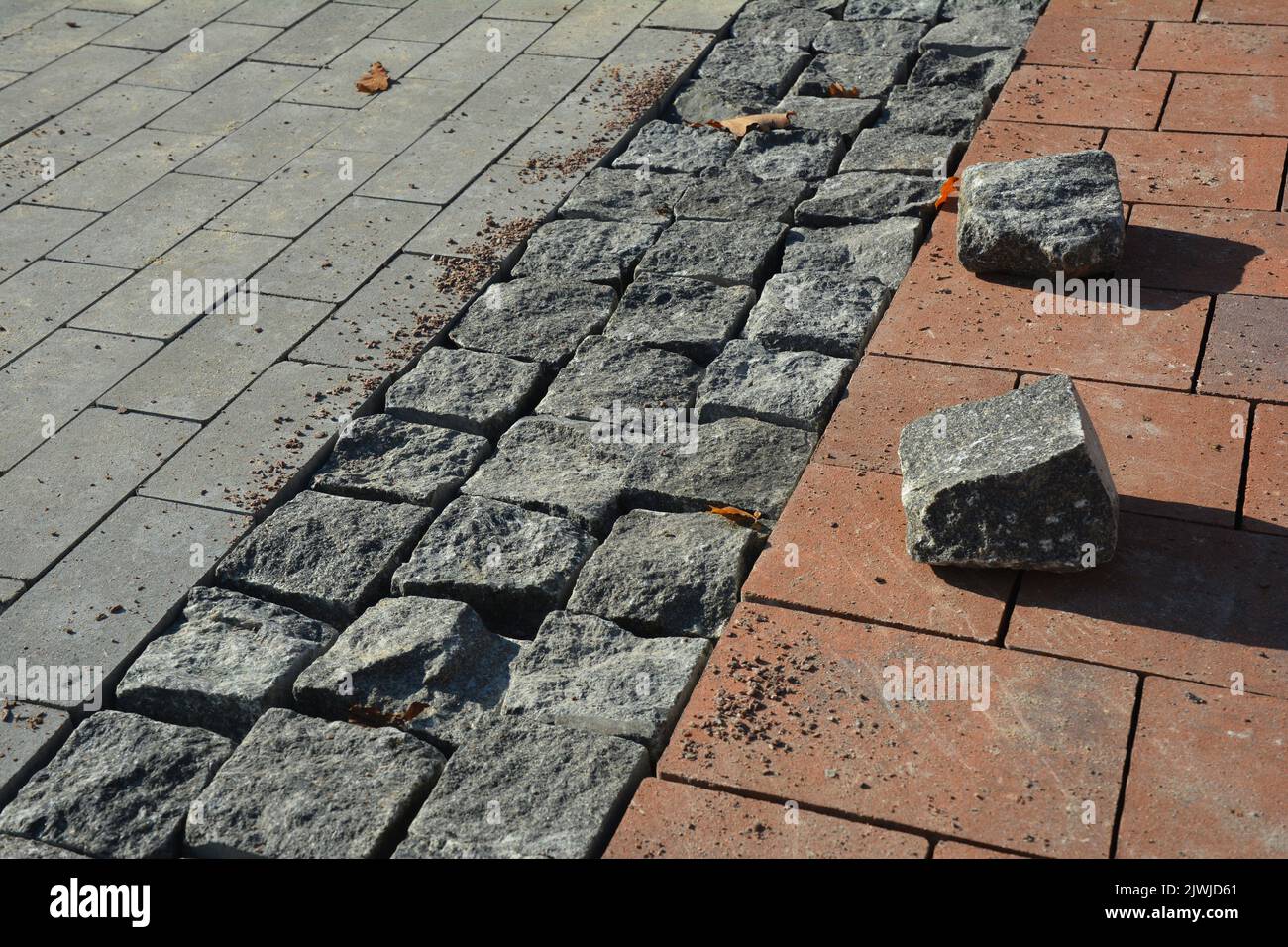 Concrete pavers design in paving walkways. The combination of wild rock