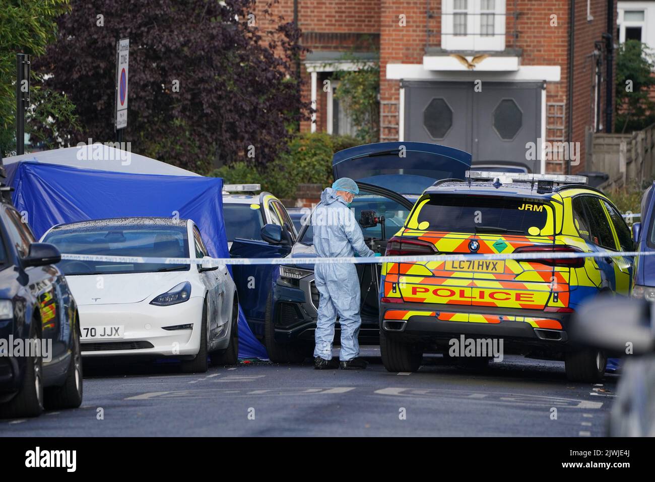A forensics officer at the scene in Kirkstall Gardens, Streatham Hill
