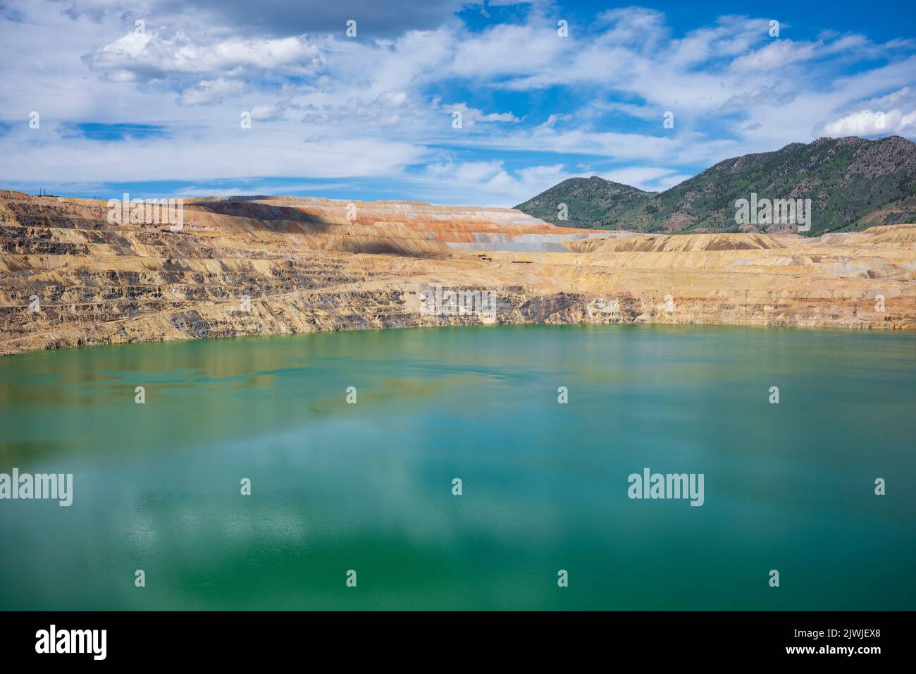 The Berkeley Pit, a former open pit copper mine located in Butte, Montana, is currently one of the largest Superfund sites that is filled with water t Stock Photo