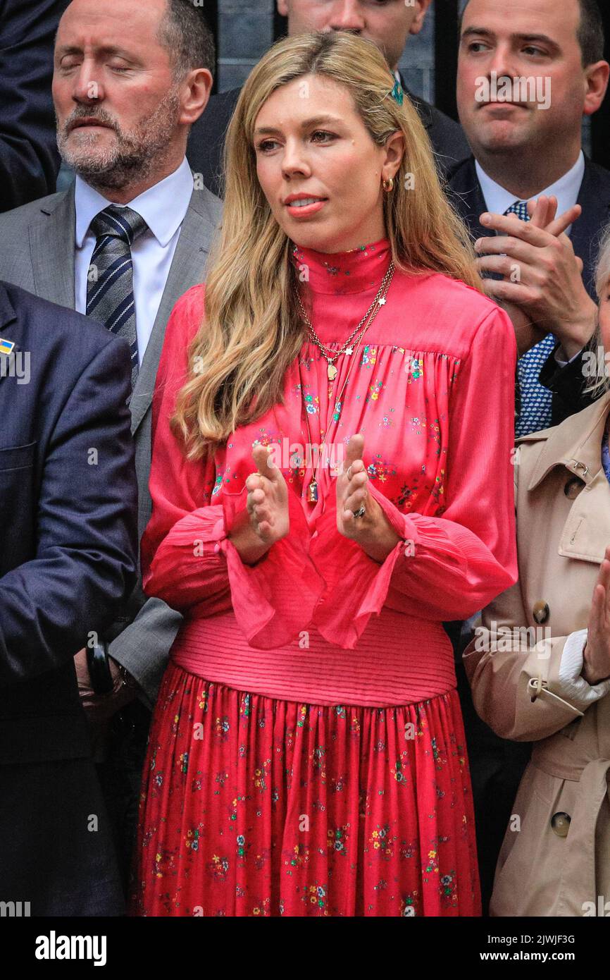 London, UK. 06th Aug, 2022. Carrie Johnson (in pink dress) clapping her