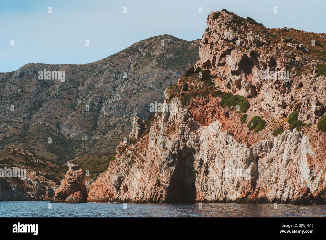Rocky island with grotto in Aegean sea landscape travel in Turkey nature beautiful destinations scenery resort summer season Stock Photo