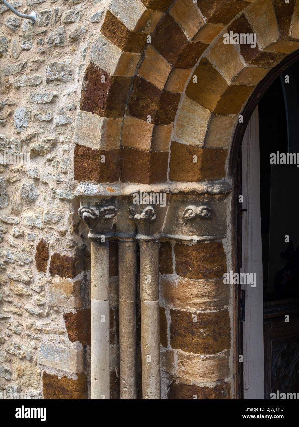 Architectural detail from the doorway of the Medieval church of St Michaels and All Angels in the village of Farndish, Bedfordshire, UK; Stock Photo