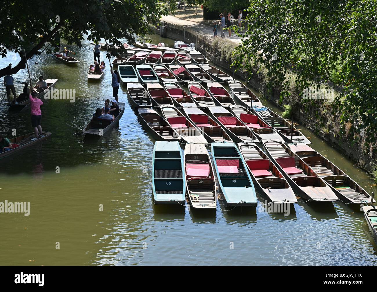 Punting is an activity that can be found on the River Cherwell by Magdalen Bridge in the city of Oxford Stock Photo