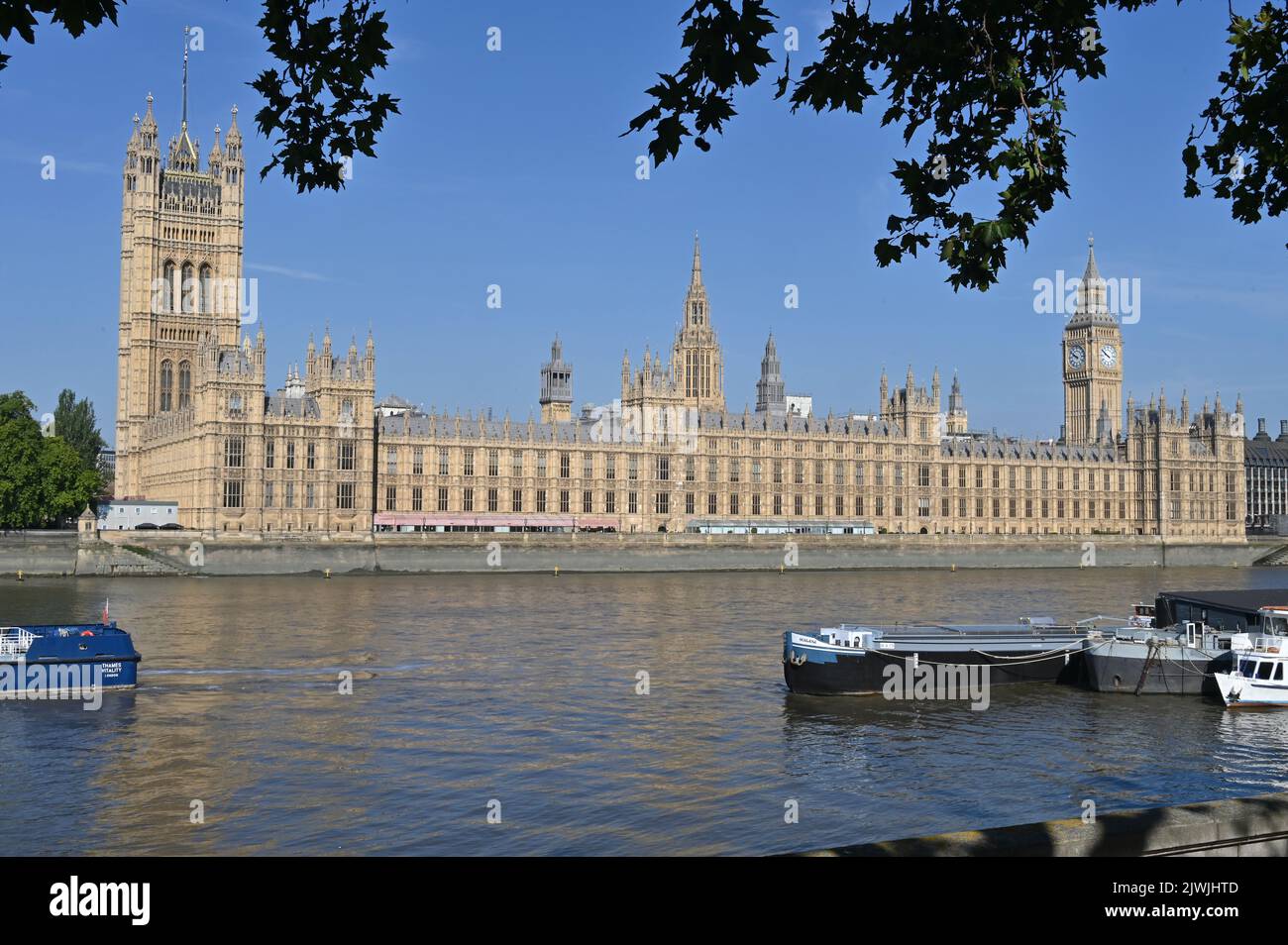 The Palace of Westminster on the north bank of the river Thames in London is the seat of the UK's government. Stock Photo