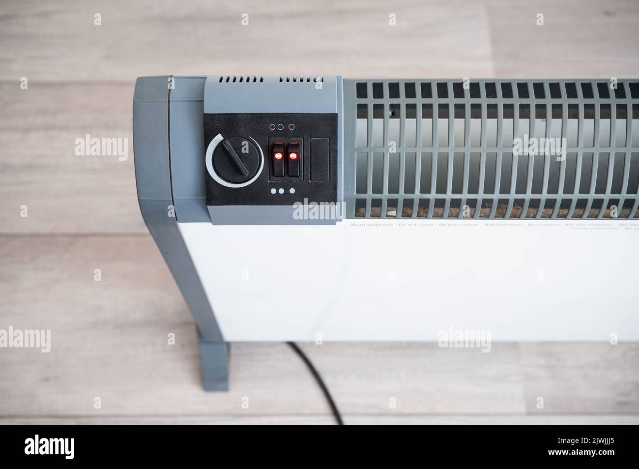 Electric convection heater heating with electric power Stock Photo