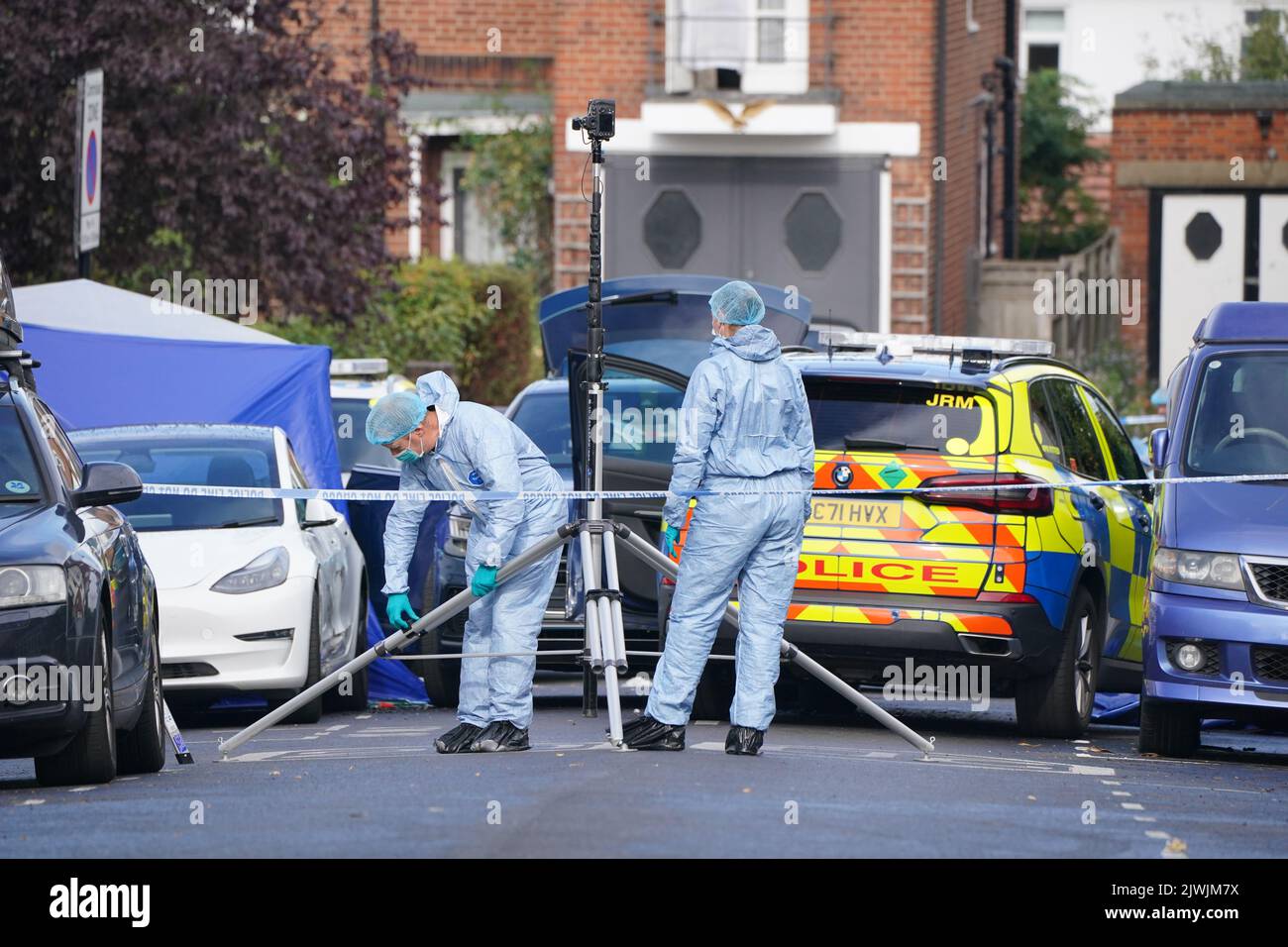 Forensics officers at the scene in Kirkstall Gardens, Streatham Hill