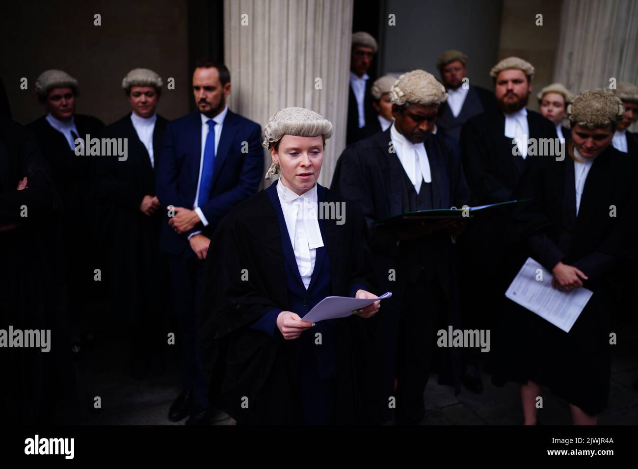 A criminal defence barrister reads a statement outside the Bristol
