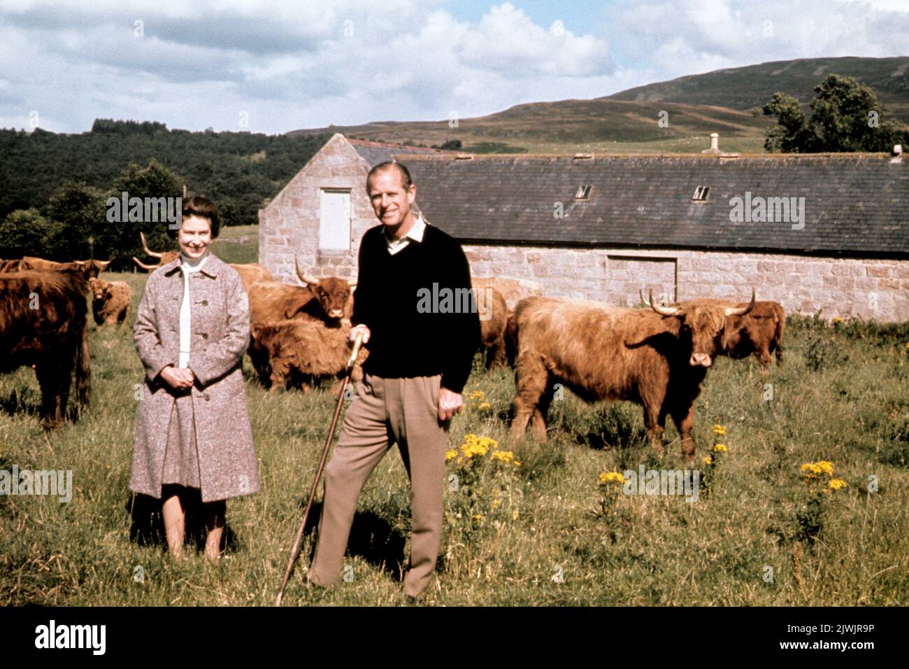 File photo dated 01/09/72 of Queen Elizabeth II and the Duke of Edinburgh during a visit to a farm on their Balmoral estate, to celebrate their Silver Wedding anniversary. The Queen is said to never be happier than when she is staying on her beloved Balmoral estate. Balmoral Castle -her private Scottish home in Aberdeenshire -was handed down to her through generations of royals after being bought for Queen Victoria by Prince Albert in 1852. Victoria described Balmoral as her 'Heaven on Earth', and it is where she sought solace after Albert's death. The turreted grey stone castle by the River D Stock Photo
