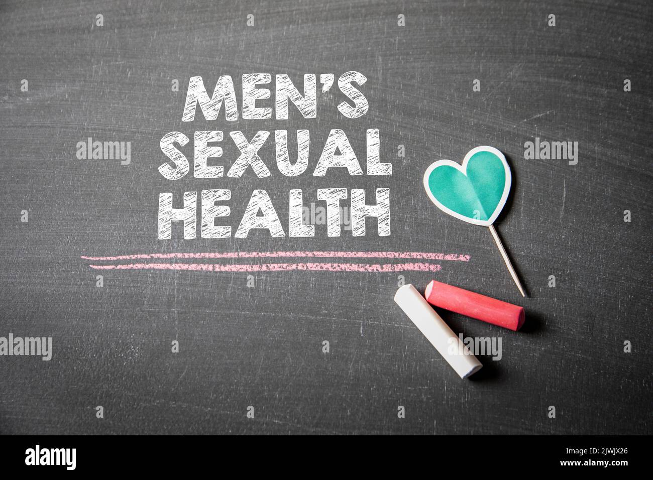 Men's sexual health. Text on a dark chalk board. Stock Photo