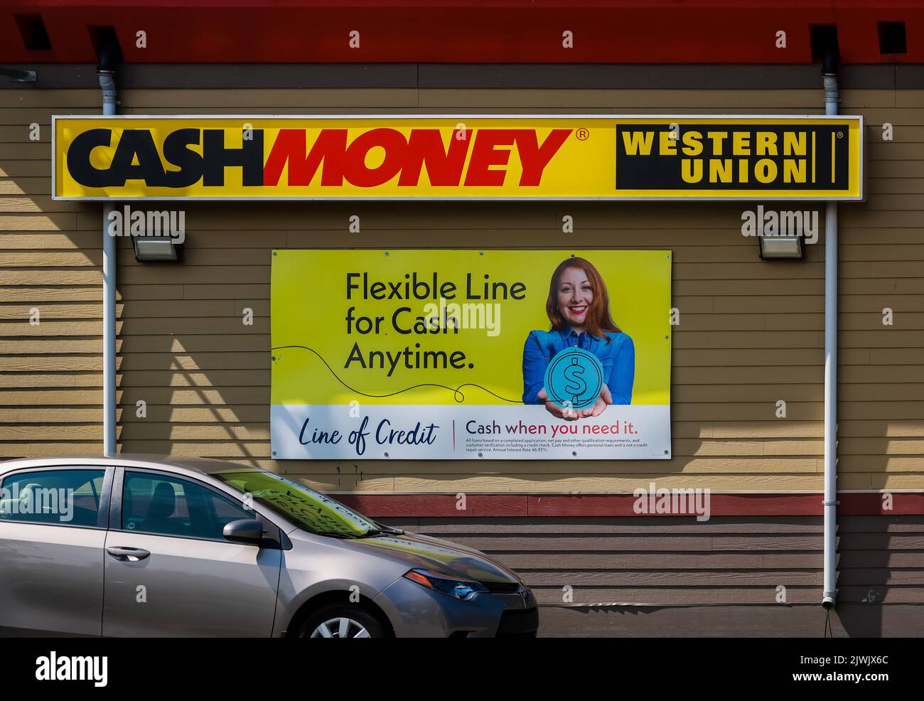 Cash Money Western Union Money Transfers Pawn Shop Store front.  Offers online payday loans, installment loans. HALIFAX, NOVA SCOTIA - AUG 2022 Stock Photo