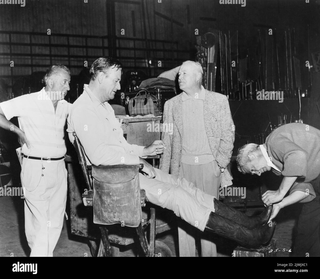 JOHN WAYNE and Director HENRTY HATHAWAY on set candid during filming of