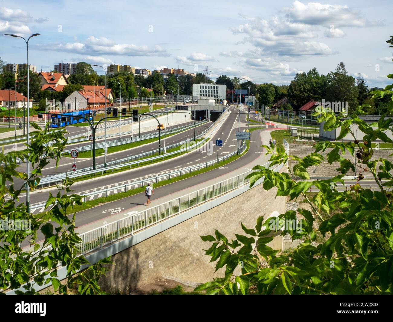 New city highway in Krakow, Poland, called Trasa Lagiewnicka with tunnels, tramway and multilevel crossroads. Slip ways and special pavements for bicy Stock Photo