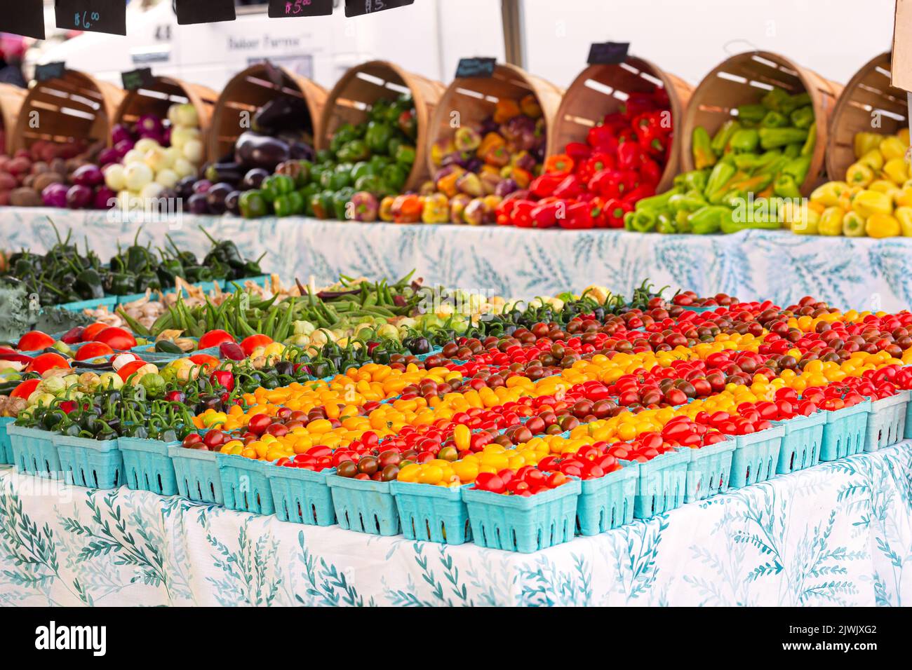 Abundance of cherry tomatoes and peppers at an outdoor market Stock ...