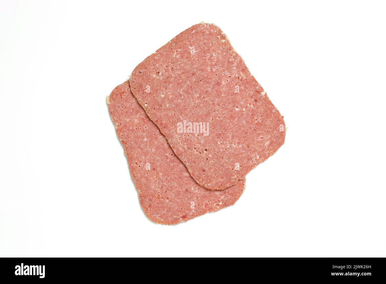 Two slices of corned beef isolated on white background cut out Stock