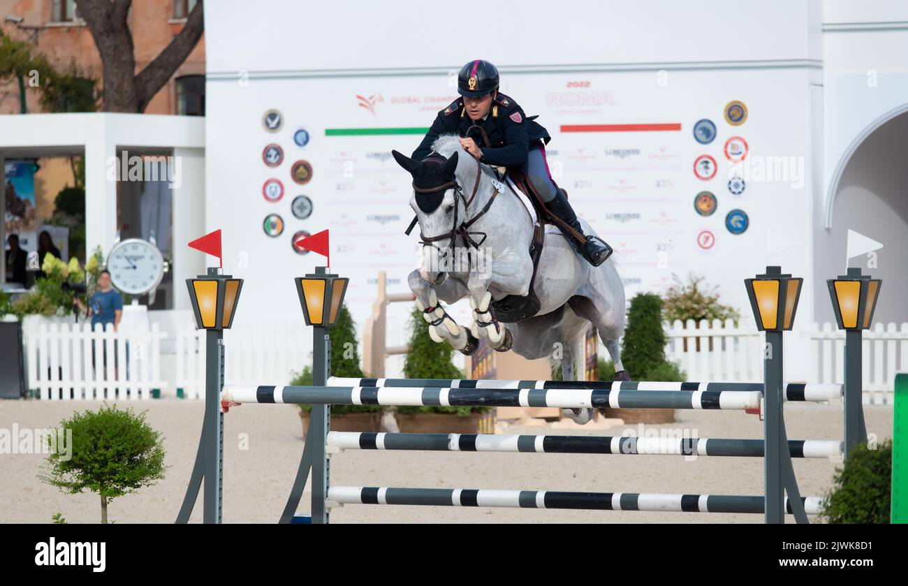 Man riding horse and jumping during equestrian competition, Italy, 2-4 september 2022, Equestrian Jumping Championship Stock Photo