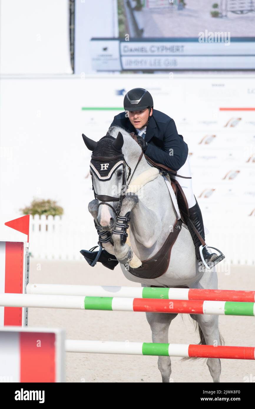 Man riding horse and jumping during equestrian competition close up detail, Italy, 2-4 september 2022, Equestrian Jumping Championship Stock Photo