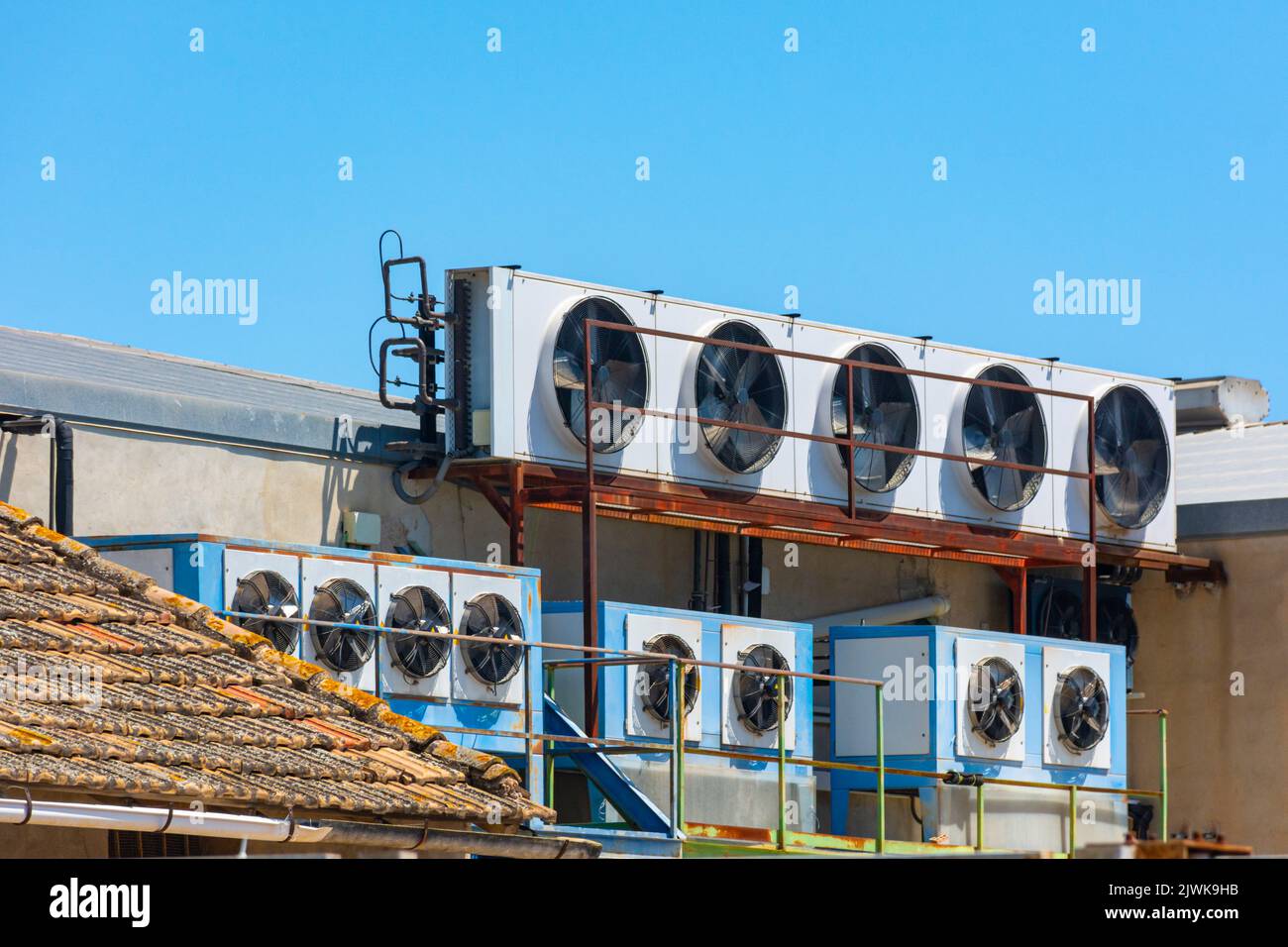 Groups of industrial refrigeration equipment installed on the roof of