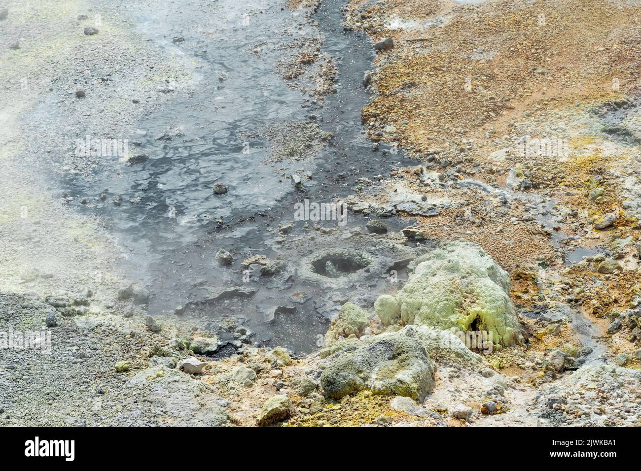 hydrothermal outlet on the shore of the hot lake in the caldera of the Golovnin volcano on the island of Kunashir Stock Photo
