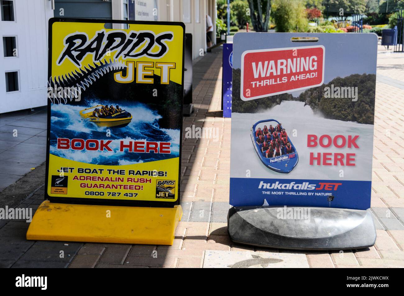A display of billboards advertising local sporting activities in Taupo  on North Island in New Zealand Stock Photo