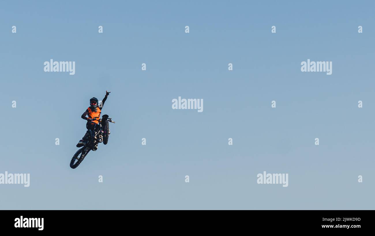 Motocross Rider Performing High Jump At Sunset Stock Photo - Download Image  Now - Motocross, Motorcycle, Jumping - iStock