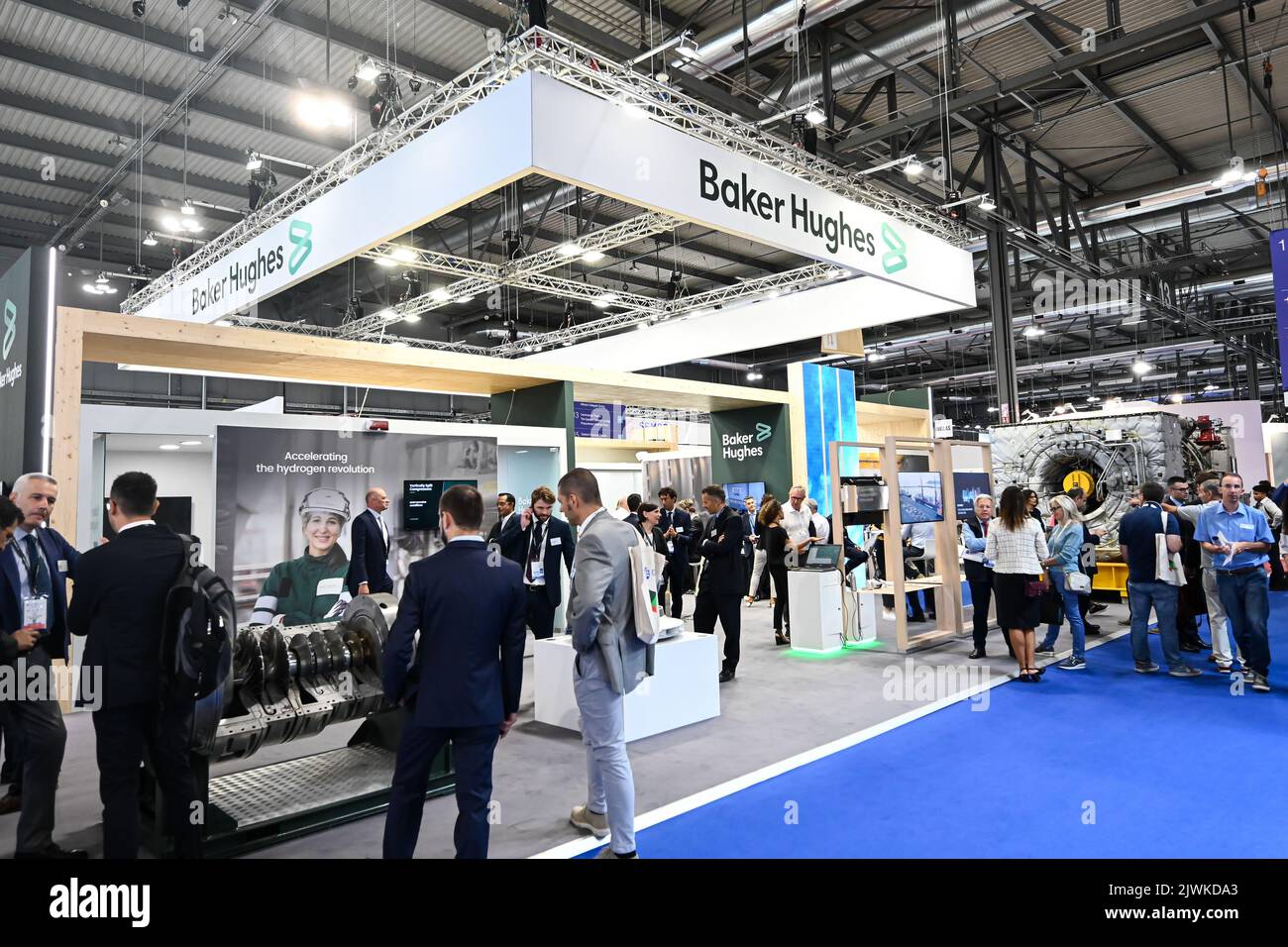 MILAN, ITALY - SEPTEMBER 6, 2022: a view of the Baker Hughes stand during Gastech 2022 trade show event in Milan Fair. Visitors and people in the hall walk through exhibitors stands and exhibit booths. Stock Photo