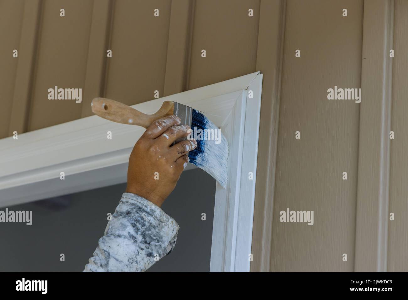 Painting wooden door trim Stock Photo Alamy