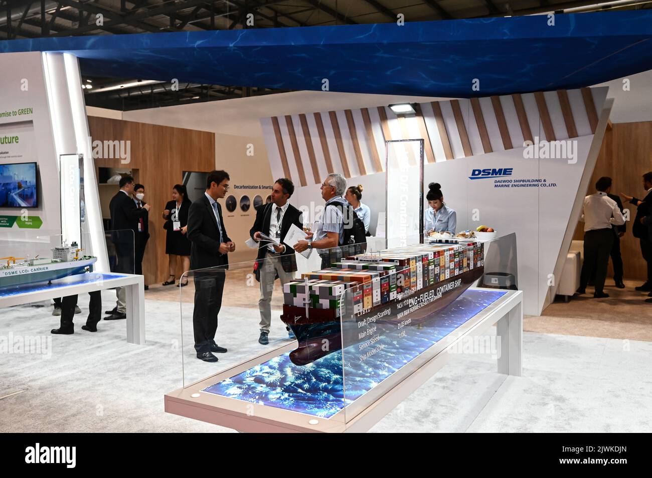 MILAN, ITALY - SEPTEMBER 6, 2022: a view of the DSME stand during Gastech 2022 trade show event in Milan Fair. Visitors and people in the hall walk through exhibitors stands and exhibit booths. Stock Photo
