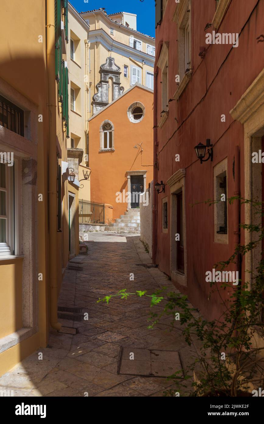 The exterior of a church in Corfu Town viewed up an alleyway Stock Photo