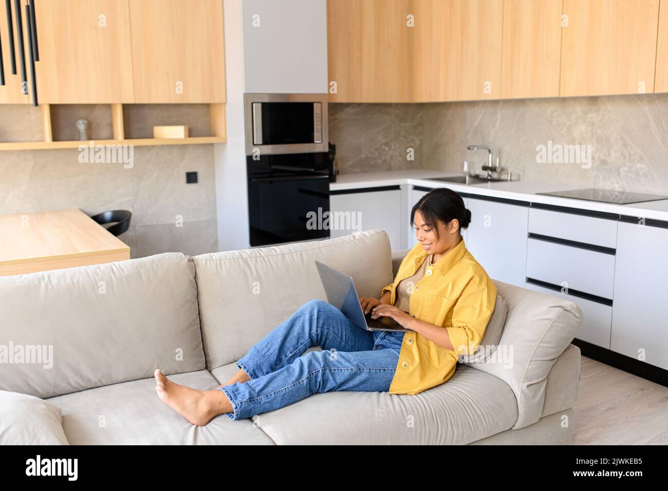 African woman sitting alone side view hi-res stock photography and ...