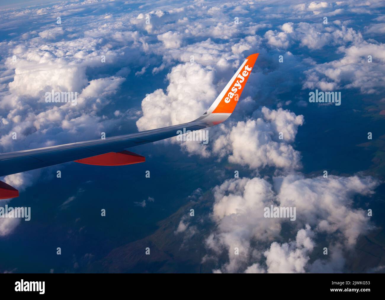 EasyJet Airbus A320 viewed from the rear of the passenger cabin while the aircraft is in flight Stock Photo