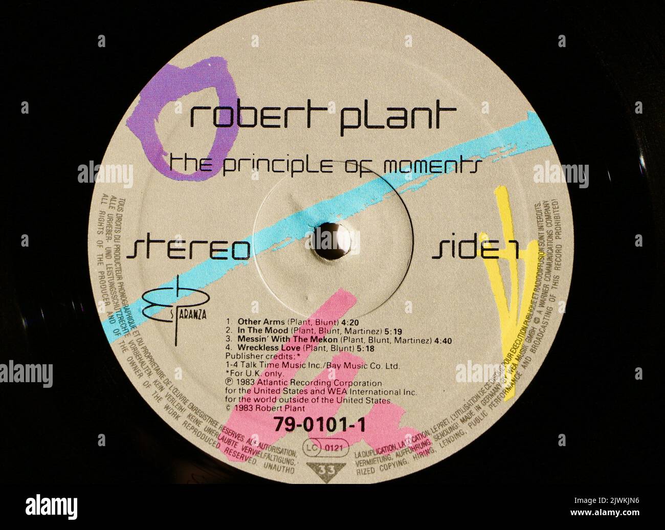 Photo close up of a centre label on an original 1983 pressing of a vinyl disc The Principle of Moments Robert Plant Stock Photo