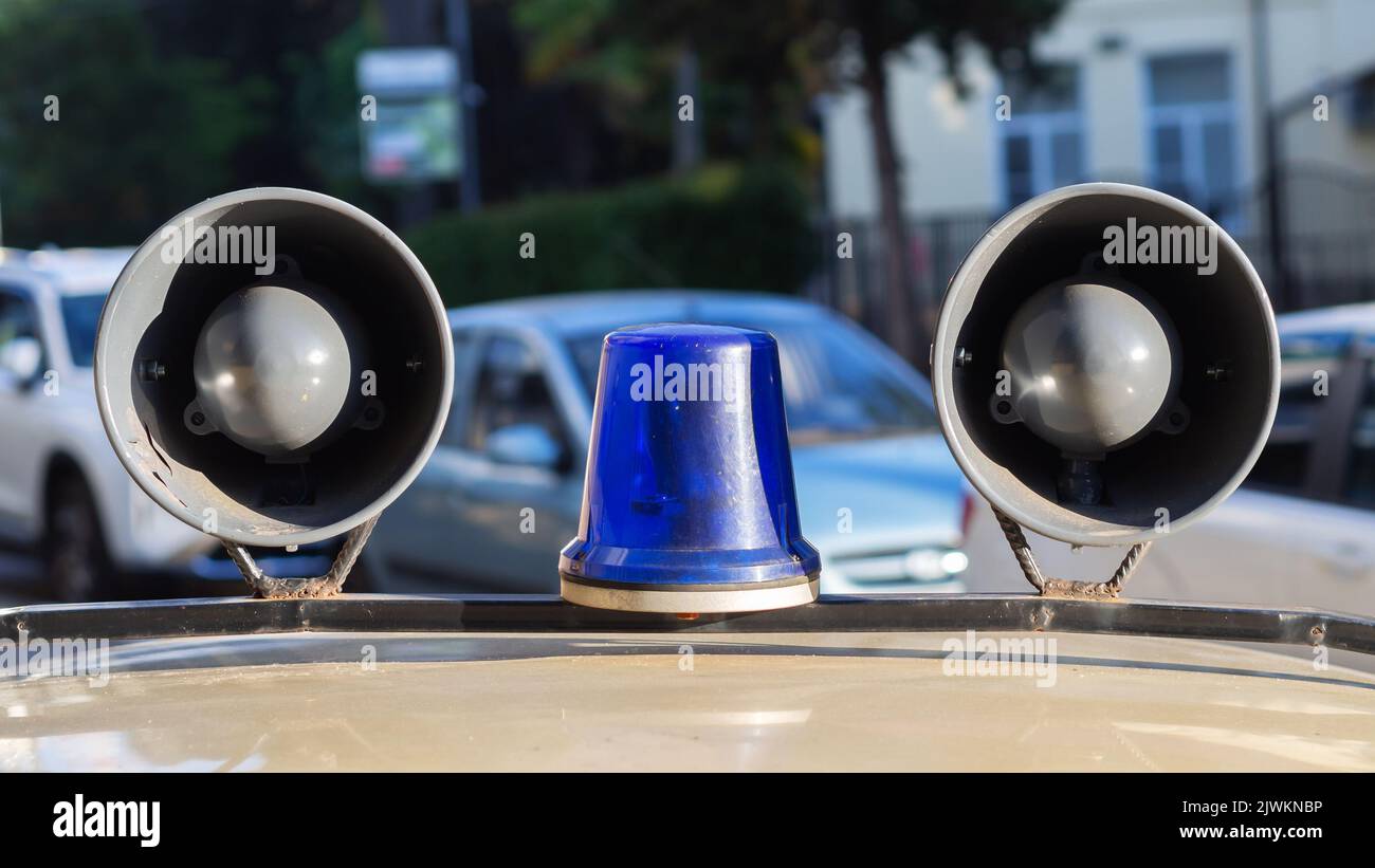 Megaphone on roof of the car. Signal police lamp. Retro style Stock