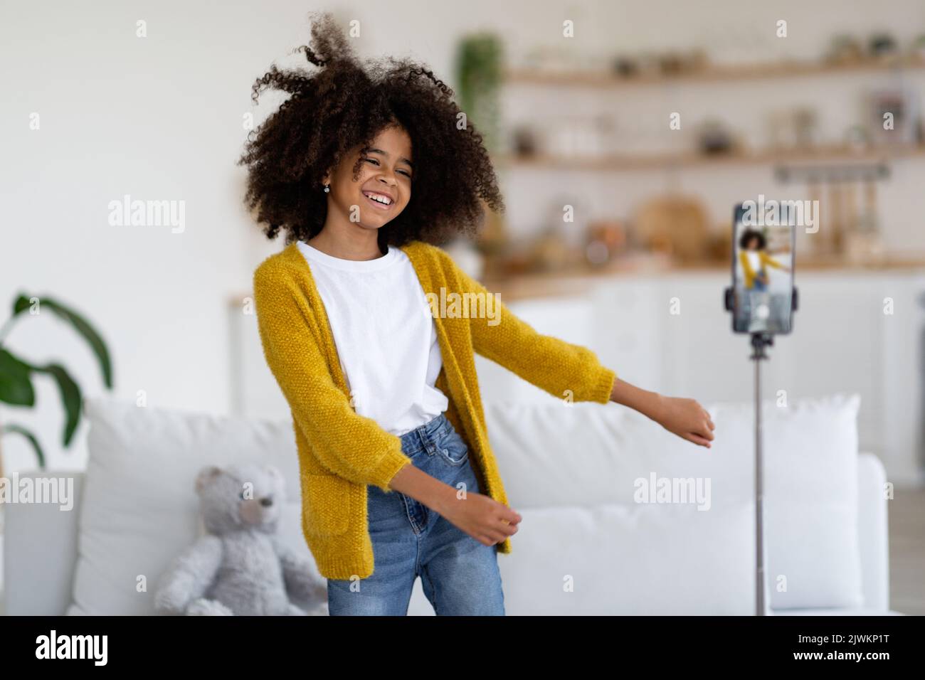 Cute african american preteen girl recording video while dancing Stock ...