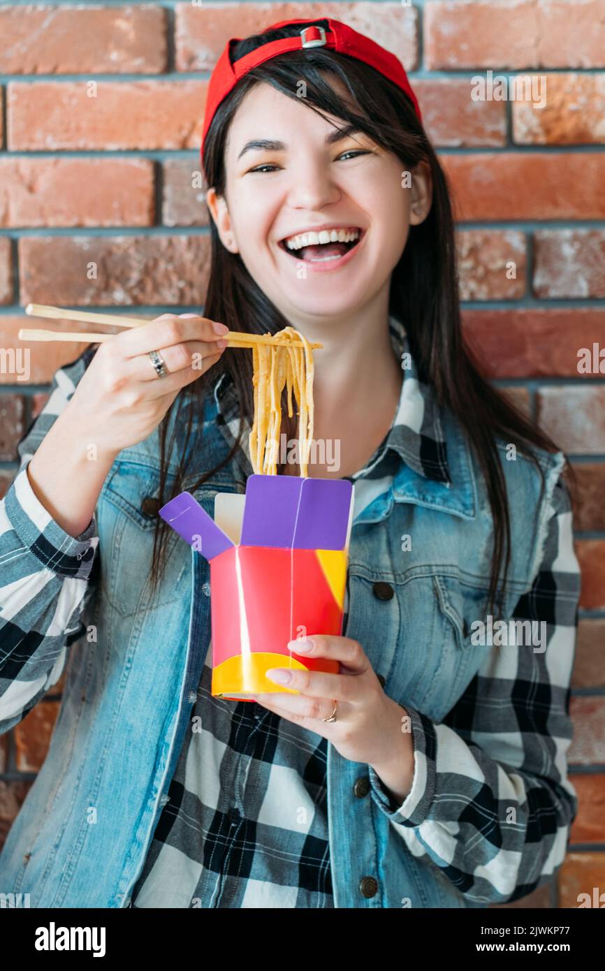 youth eating habit female chinese noodles yummy Stock Photo